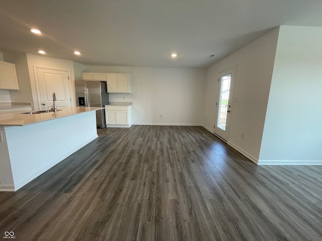1319 Fleming Dr, Greenfield, IN 46140 - unfurnished living room featuring dark wood-type flooring and recessed lighting