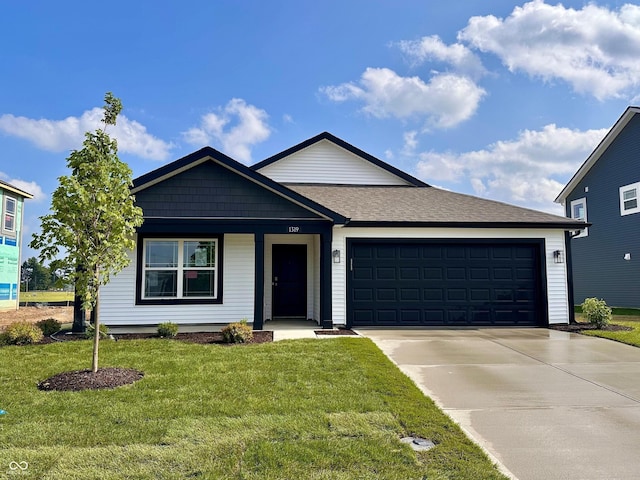 1319 Fleming Dr, Greenfield, IN 46140 - ranch-style house with driveway, a garage, and a front yard