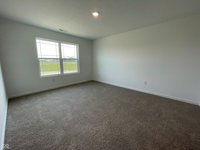 1319 Fleming Dr, Greenfield, IN 46140 - unfurnished room with baseboards and dark colored carpet