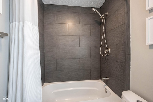 bathroom with toilet and shower / tub combo