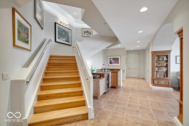 10919 Brigantine Dr, Indianapolis, IN 46256 - staircase with beverage cooler and recessed lighting