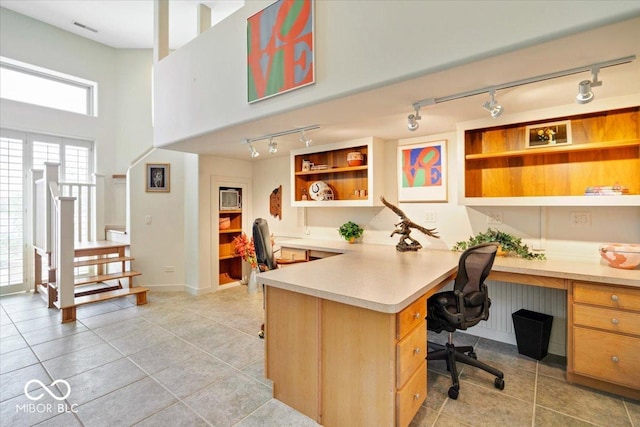 10919 Brigantine Dr, Indianapolis, IN 46256 - office with built in desk, light tile patterned floors, track lighting, baseboards, and visible vents
