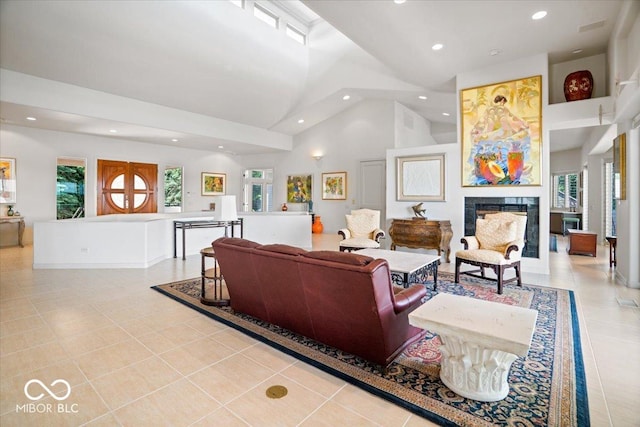 10919 Brigantine Dr, Indianapolis, IN 46256 - living area featuring recessed lighting, a high end fireplace, high vaulted ceiling, and light tile patterned flooring