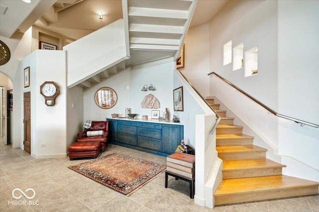 10919 Brigantine Dr, Indianapolis, IN 46256 - stairs featuring a high ceiling and tile patterned flooring