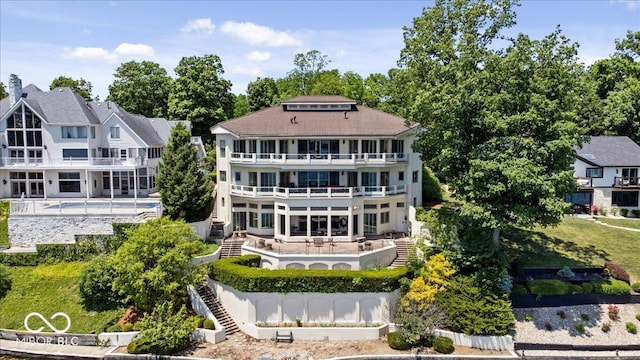 10919 Brigantine Dr, Indianapolis, IN 46256 - view of building exterior with an outdoor pool and stairs
