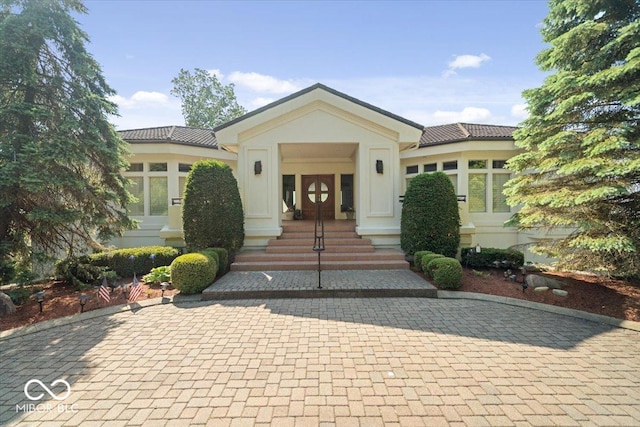 10919 Brigantine Dr, Indianapolis, IN 46256 - view of front facade with french doors and a tile roof