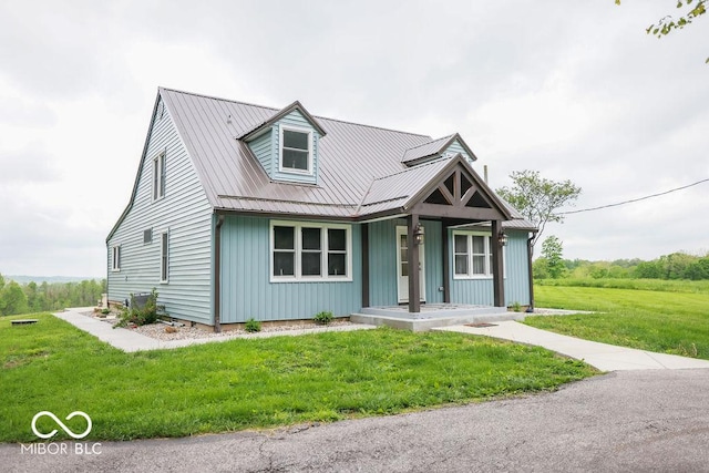 3270 Freedom Rd, Spencer, IN 47460 - view of front of house with a front lawn, metal roof, a porch, and board and batten siding