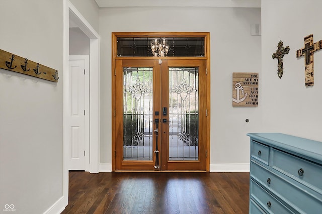 foyer featuring baseboards, dark wood-style floors, and french doors