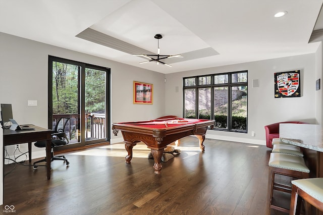 playroom with baseboards, billiards, a tray ceiling, and wood finished floors