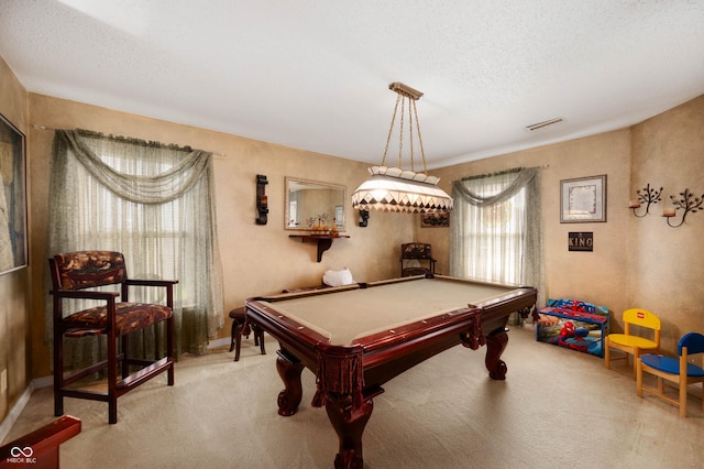 rec room featuring light colored carpet, a textured ceiling, pool table, and visible vents