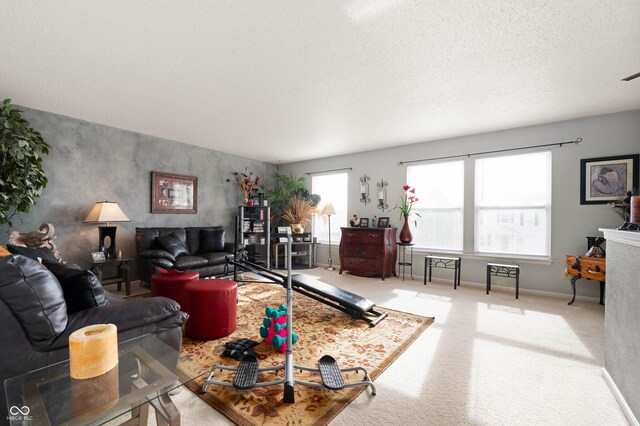 carpeted living room with a textured ceiling and visible vents