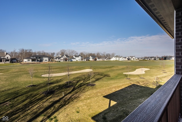 view of community with a residential view and a lawn