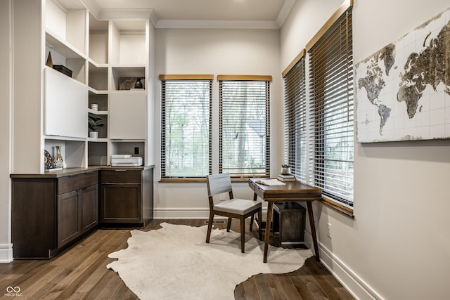 living area featuring crown molding, baseboards, and dark wood finished floors