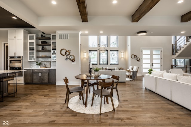 dining room featuring visible vents, recessed lighting, and beam ceiling