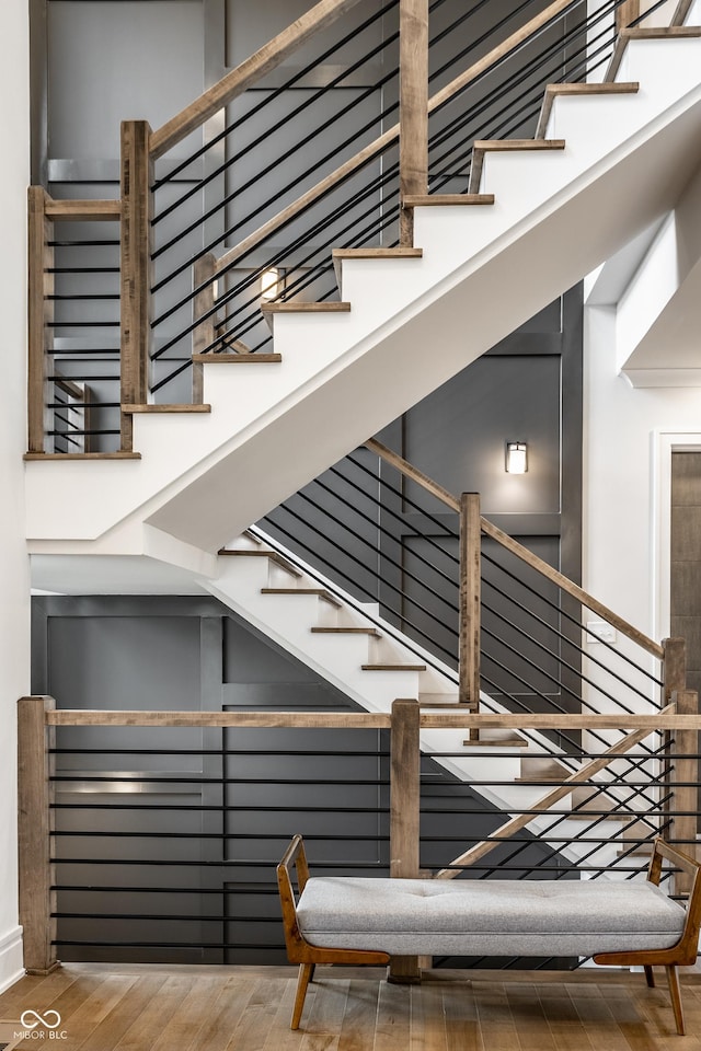 staircase featuring wood finished floors