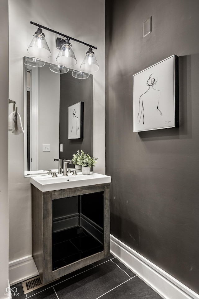 bathroom with tile patterned flooring and vanity
