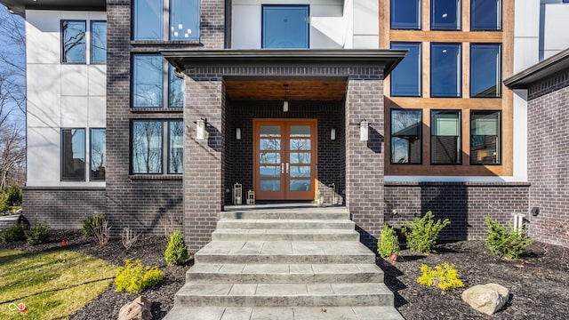 entrance to property with brick siding
