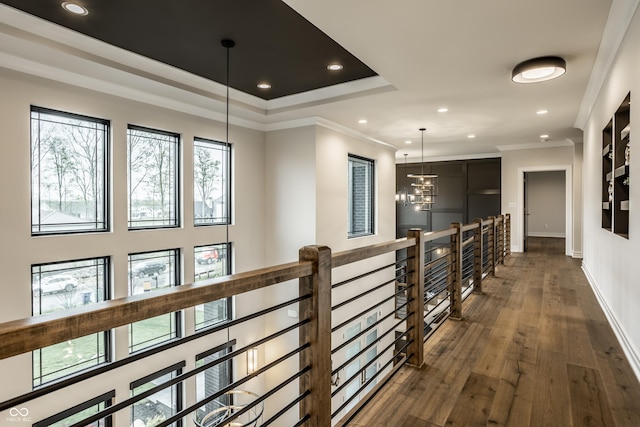 corridor with baseboards, an upstairs landing, ornamental molding, recessed lighting, and dark wood-type flooring
