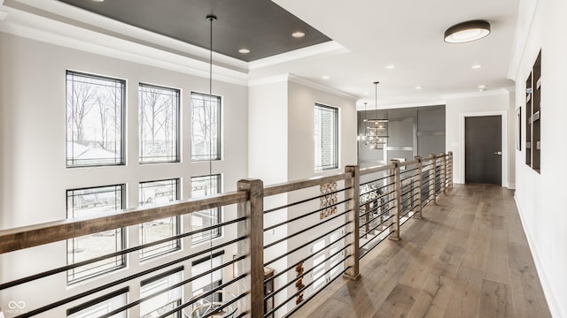 hallway with crown molding, recessed lighting, baseboards, and wood finished floors