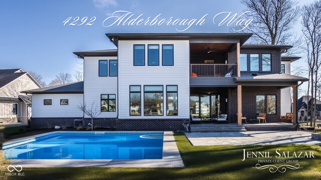 4292 Alderborough Way, Zionsville, IN 46077 - rear view of property featuring a balcony, a patio, and an outdoor pool