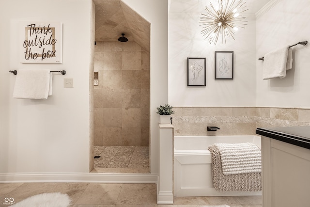 1995 W 116th St, Carmel, IN 46032 - full bathroom featuring tile patterned flooring, a notable chandelier, a tile shower, and a garden tub