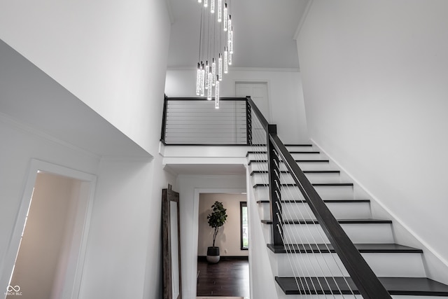 1995 W 116th St, Carmel, IN 46032 - staircase with crown molding and a high ceiling