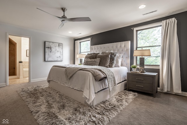 1995 W 116th St, Carmel, IN 46032 - bedroom featuring crown molding, visible vents, baseboards, connected bathroom, and a ceiling fan