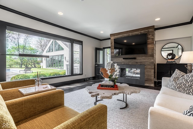 1995 W 116th St, Carmel, IN 46032 - living area with a multi sided fireplace, crown molding, wood finished floors, baseboards, and recessed lighting