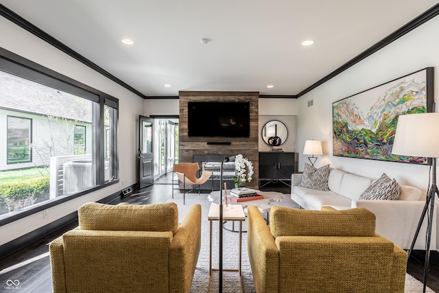 1995 W 116th St, Carmel, IN 46032 - living room featuring visible vents, ornamental molding, wood finished floors, recessed lighting, and a large fireplace