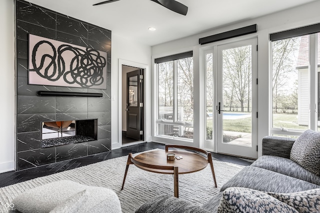1995 W 116th St, Carmel, IN 46032 - living area featuring a premium fireplace, ceiling fan, recessed lighting, and a wealth of natural light