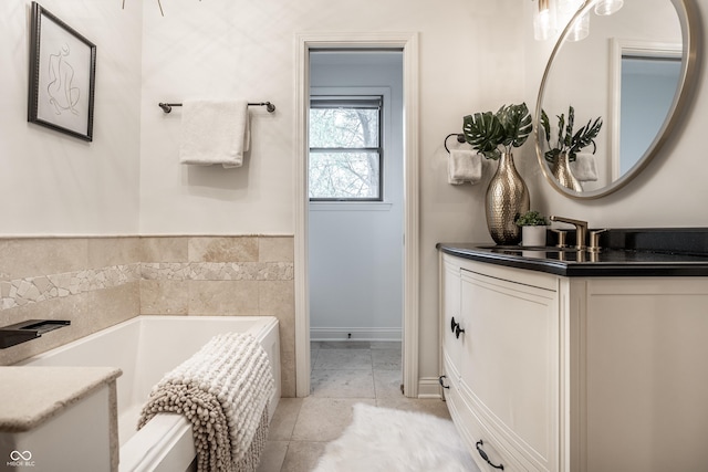 1995 W 116th St, Carmel, IN 46032 - full bathroom featuring tile patterned floors, baseboards, a bath, and vanity