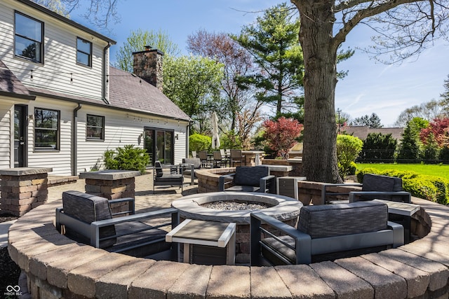 1995 W 116th St, Carmel, IN 46032 - view of patio featuring an outdoor living space with a fire pit