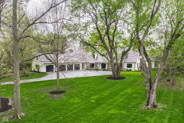 1995 W 116th St, Carmel, IN 46032 - view of front facade featuring curved driveway and a front lawn