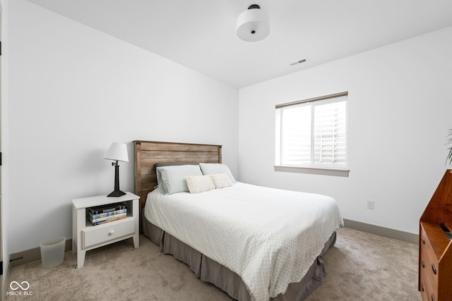 bedroom with light colored carpet and visible vents