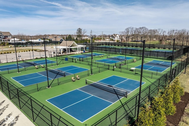 view of tennis court with fence