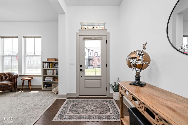 foyer featuring baseboards