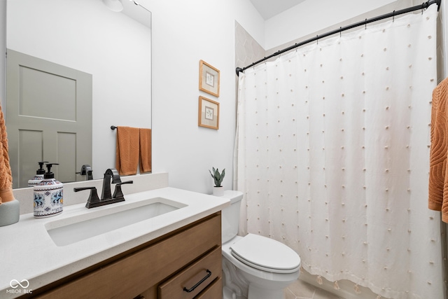 bathroom featuring vanity, tile patterned flooring, curtained shower, and toilet