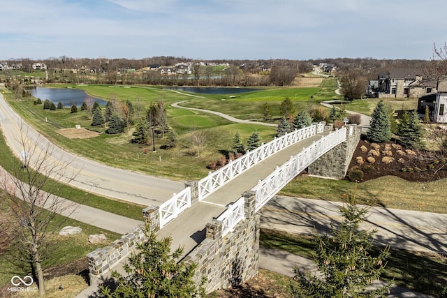aerial view featuring a water view and view of golf course