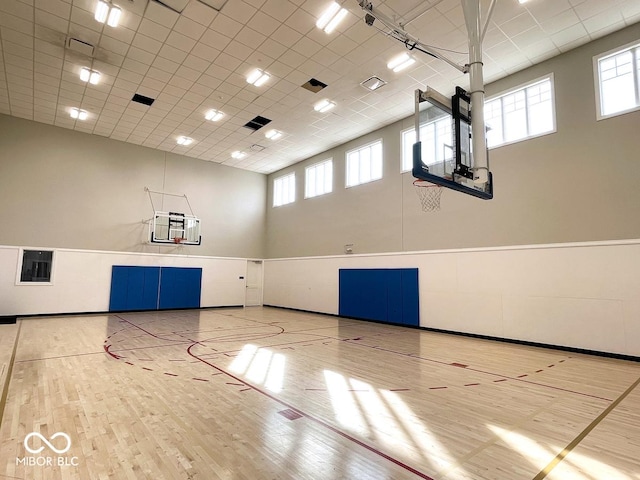 view of basketball court featuring plenty of natural light and community basketball court