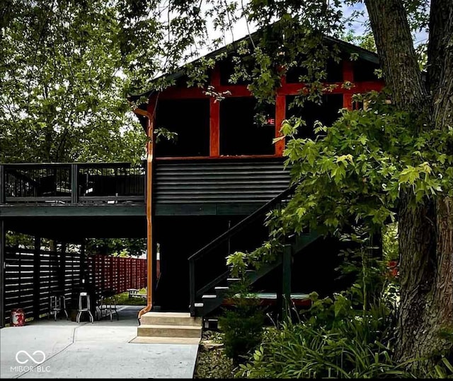 surrounding community featuring a wooden deck and stairs