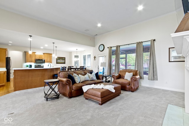 living area with light colored carpet, ornamental molding, baseboards, and recessed lighting