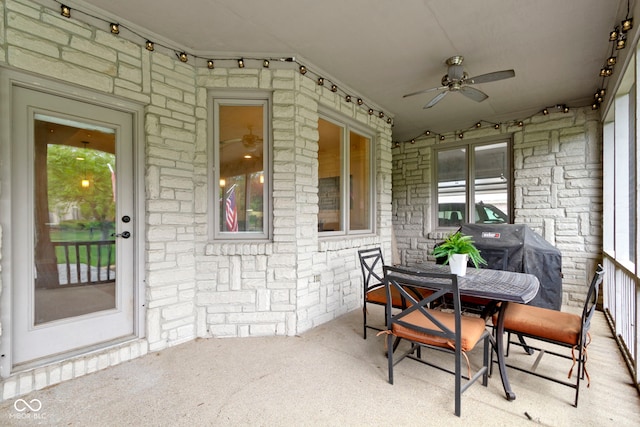 view of patio / terrace with ceiling fan and outdoor dining area