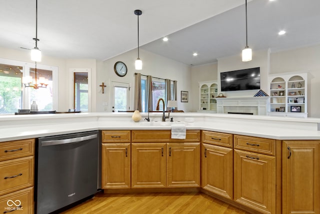 kitchen with a sink, plenty of natural light, and stainless steel dishwasher