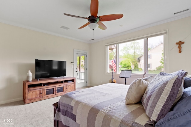 bedroom with visible vents, ornamental molding, light carpet, and multiple windows