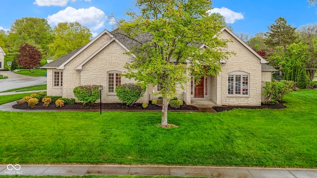single story home with stone siding and a front lawn