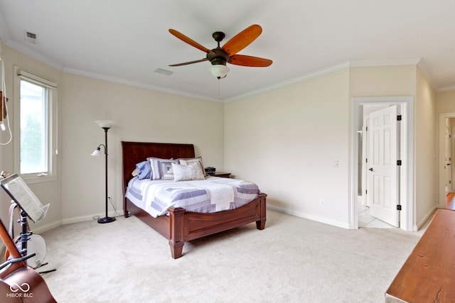 bedroom featuring crown molding, visible vents, baseboards, a ceiling fan, and carpet