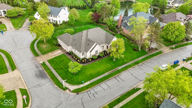 aerial view featuring a water view and a residential view