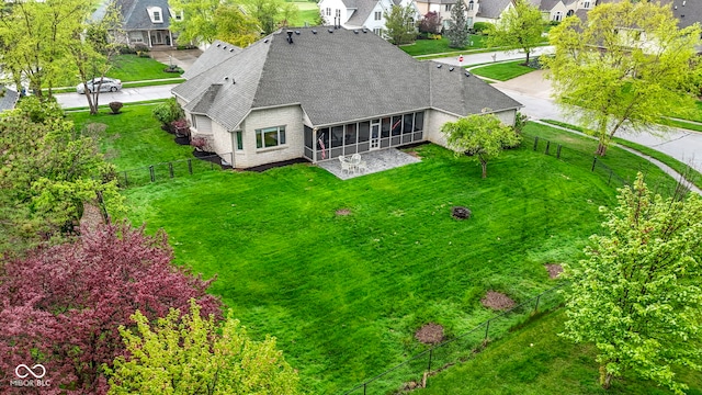 birds eye view of property with a residential view