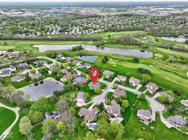 bird's eye view with a water view, view of golf course, and a residential view