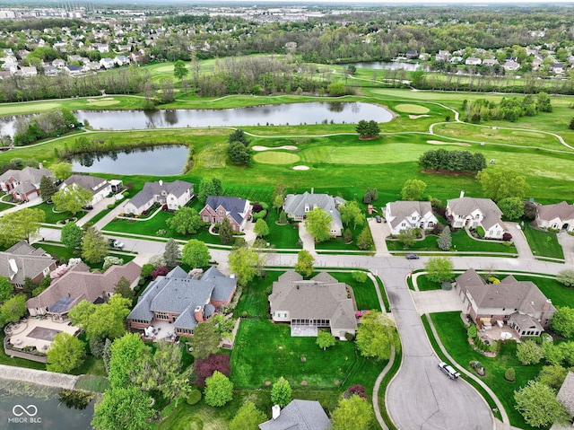 bird's eye view with a water view, view of golf course, and a residential view